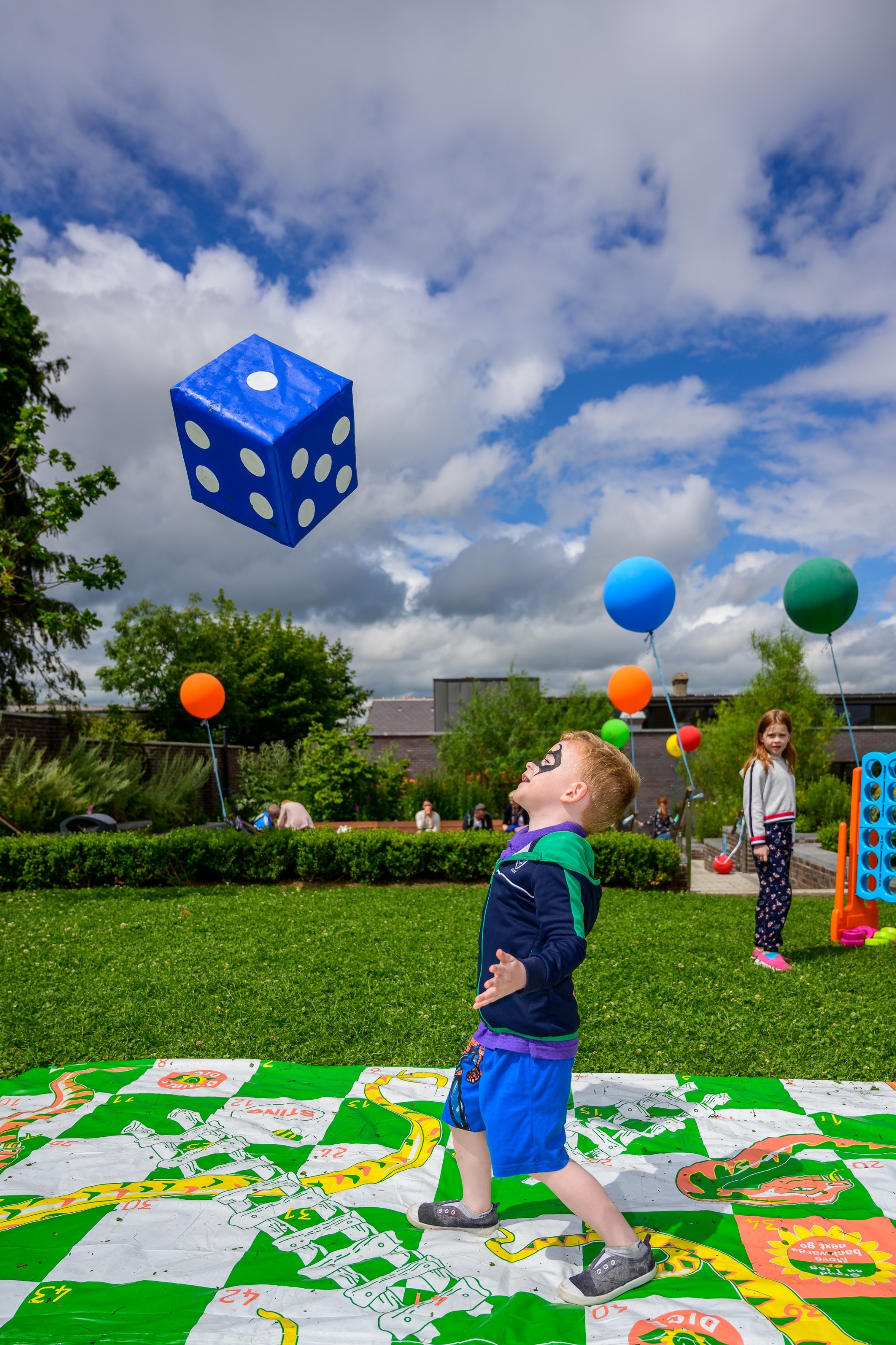 Ryan Fitzpatrick throws the dice at the Round Tower Family Fun day in Clondalkin.
